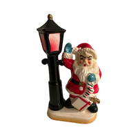 Load image into Gallery viewer, Vintage Santa with Presents by Lamp Post Figurine
