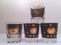 Load image into Gallery viewer, Fred Press - Signed Mid-Century Celestial/Atomic Burst 22-Karat Gold &amp; Black Whiskey Glasses (Set of 4)
