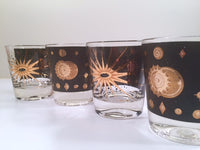 Load image into Gallery viewer, Fred Press - Signed Mid-Century Celestial/Atomic Burst 22-Karat Gold &amp; Black Whiskey Glasses (Set of 4)
