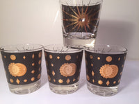 Load image into Gallery viewer, Fred Press - Signed Mid-Century Celestial/Atomic Burst 22-Karat Gold &amp; Black Whiskey Glasses (Set of 4)
