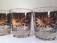 Load image into Gallery viewer, Fred Press - Signed Mid-Century Celestial/Atomic Burst 22-Karat Gold &amp; Black Whiskey Glasses (Set of 4)
