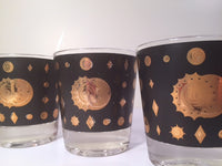 Load image into Gallery viewer, Fred Press - Signed Mid-Century Celestial/Atomic Burst 22-Karat Gold &amp; Black Whiskey Glasses (Set of 4)
