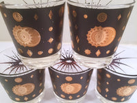 Load image into Gallery viewer, Fred Press - Signed Mid-Century Celestial/Atomic Burst 22-Karat Gold &amp; Black Whiskey Glasses (Set of 5)
