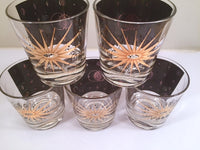Load image into Gallery viewer, Fred Press - Signed Mid-Century Celestial/Atomic Burst 22-Karat Gold &amp; Black Whiskey Glasses (Set of 5)
