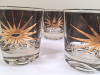 Load image into Gallery viewer, Fred Press - Signed Mid-Century Celestial/Atomic Burst 22-Karat Gold &amp; Black Whiskey Glasses (Set of 5)
